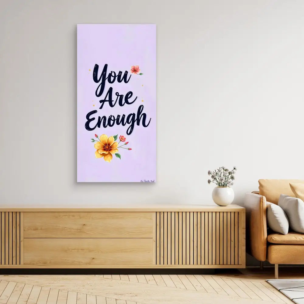 A motivational wall art canvas featuring the text ’You Are Enough’ with floral accents.