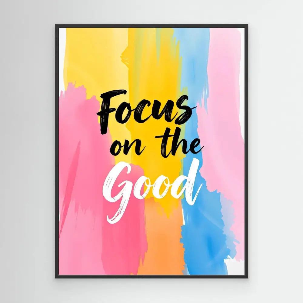 Motivational wall art with ’Focus on the Good’ text on a colorful watercolor background.