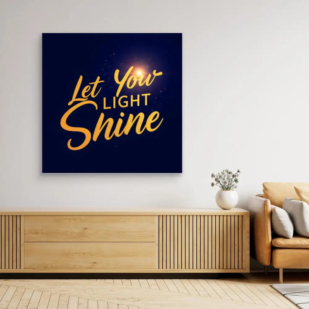 Motivational wall art featuring golden text ’Let Your Light Shine’ on a dark blue background.