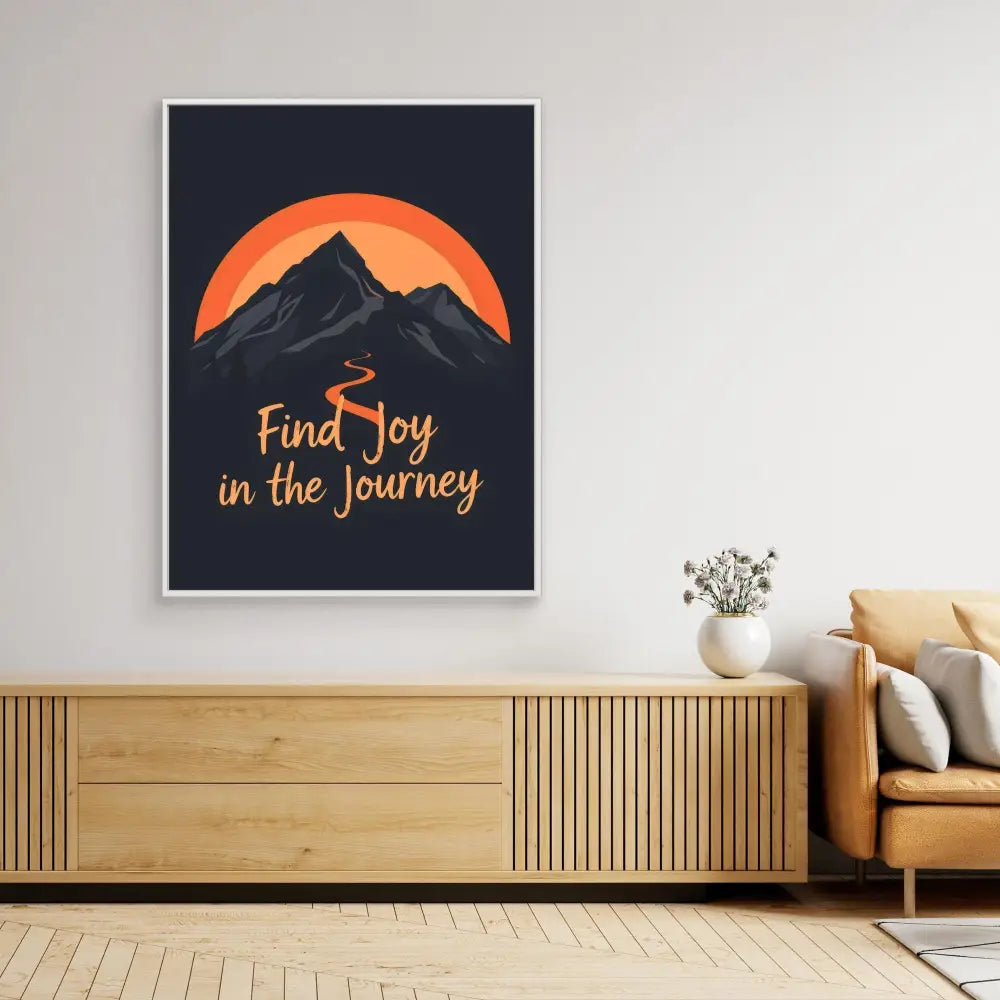 Motivational wall art featuring a mountain silhouette against an orange sun with the text ’Find Joy in the Journey’