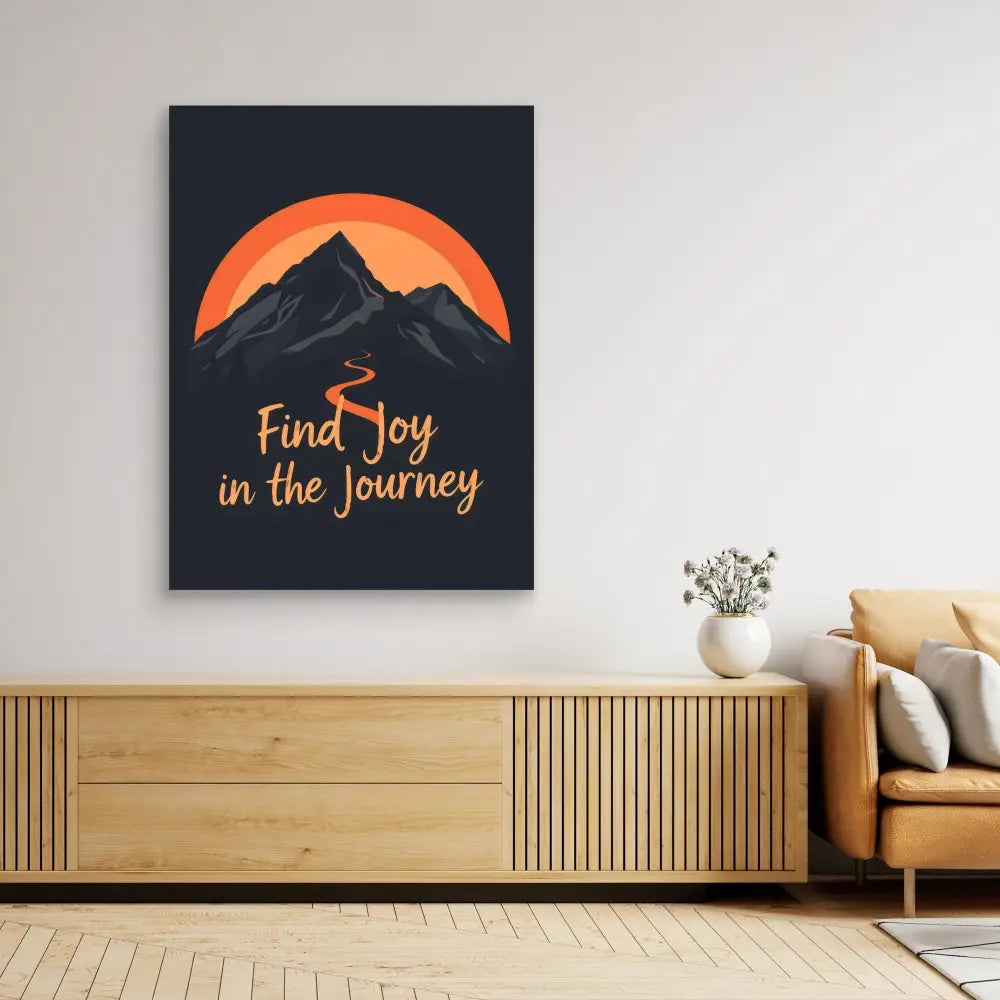 Motivational wall art featuring a mountain silhouette against an orange sun with the text ’Find Joy in the Journey’