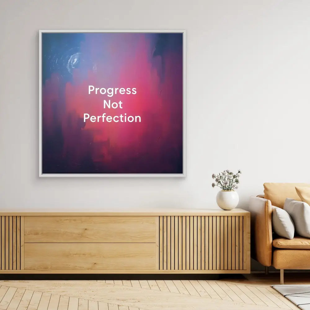 Motivational wall art displaying ’Progress Not Perfection’ text on a pink and purple gradient background.