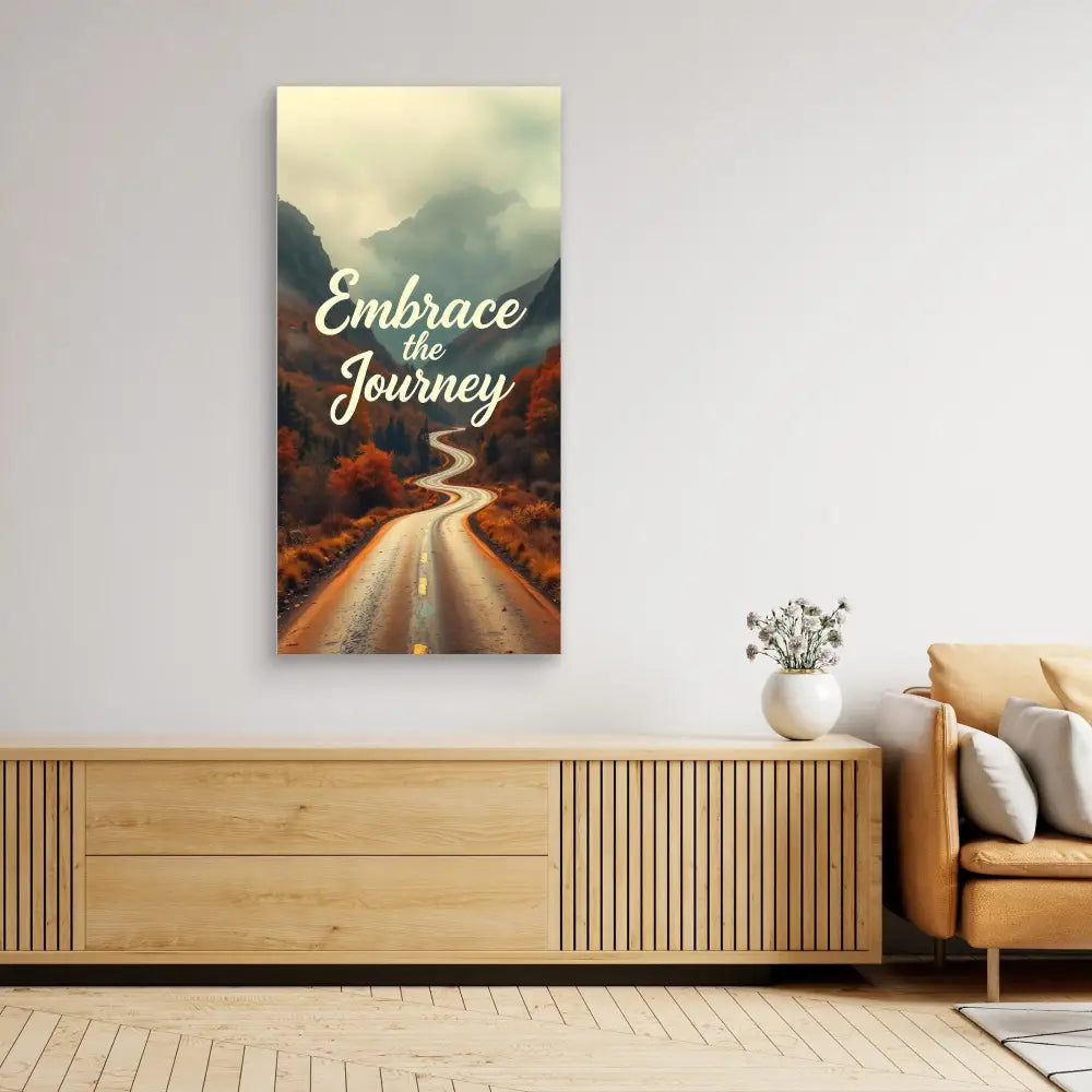 Motivational wall art featuring a winding road and ’Embrace the Journey’ text against a moody landscape.