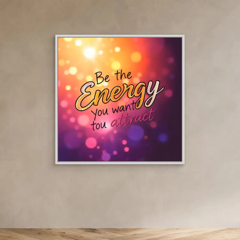 Motivational wall art with the text ’Be the Energy you want to attract’ on a colorful bokeh background.