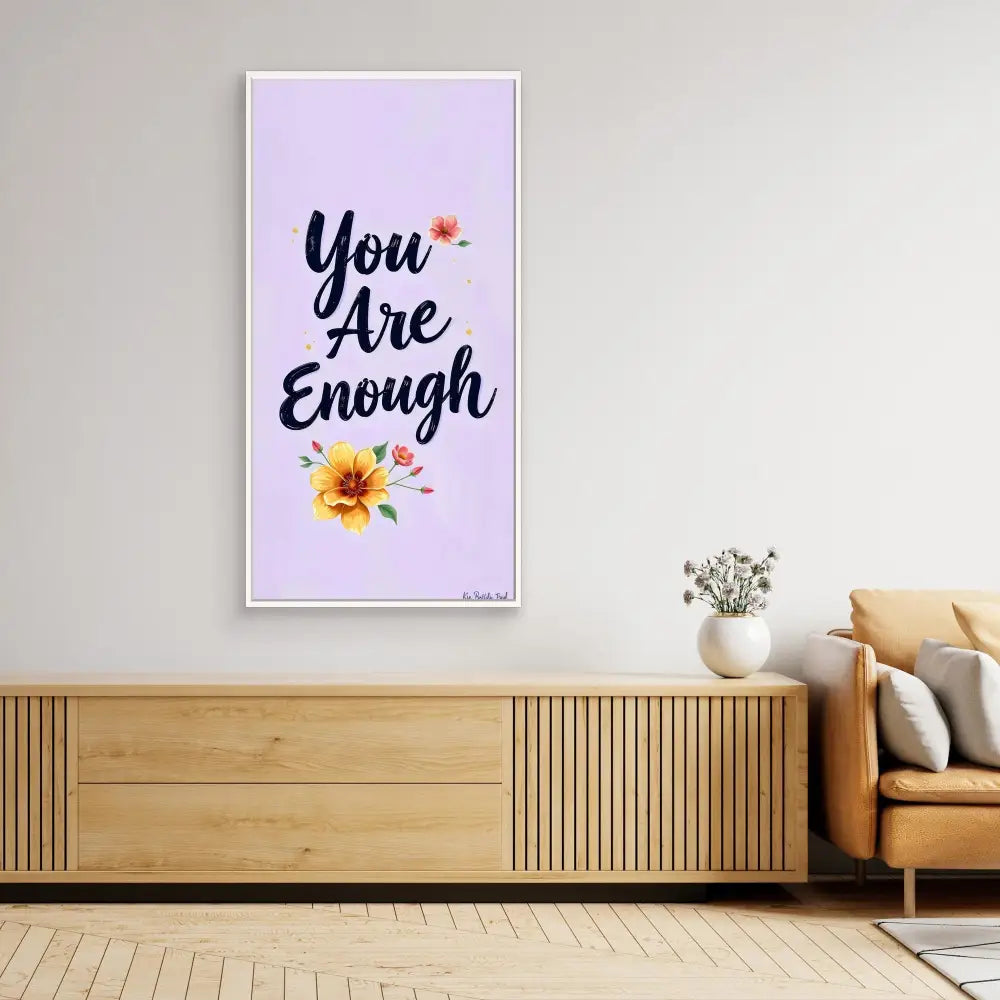 Motivational wall art featuring the text ’You Are Enough’ with floral accents on a lavender background.