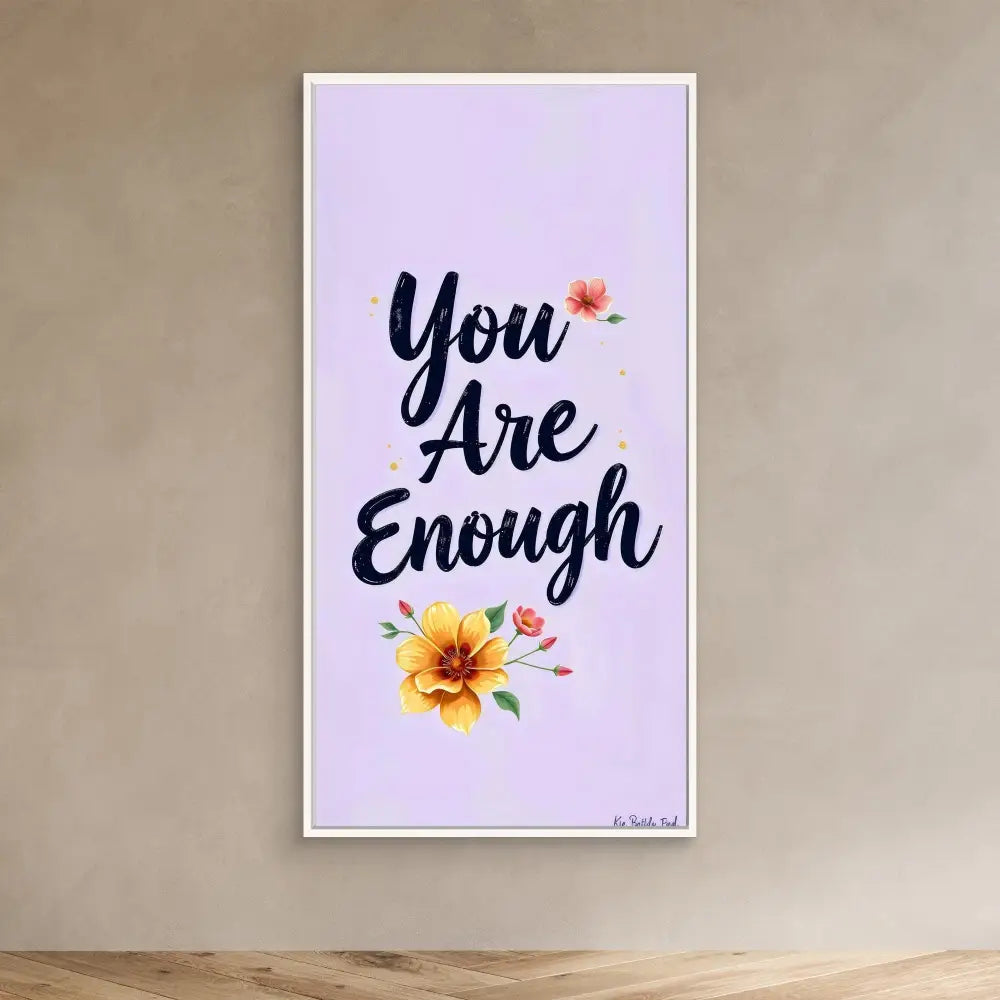 A motivational wall art featuring the text ’You Are Enough’ with floral accents.