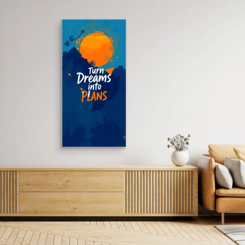 Motivational wall art featuring the text ’Turn Dreams into Plans’ with an orange sun design on a blue background.