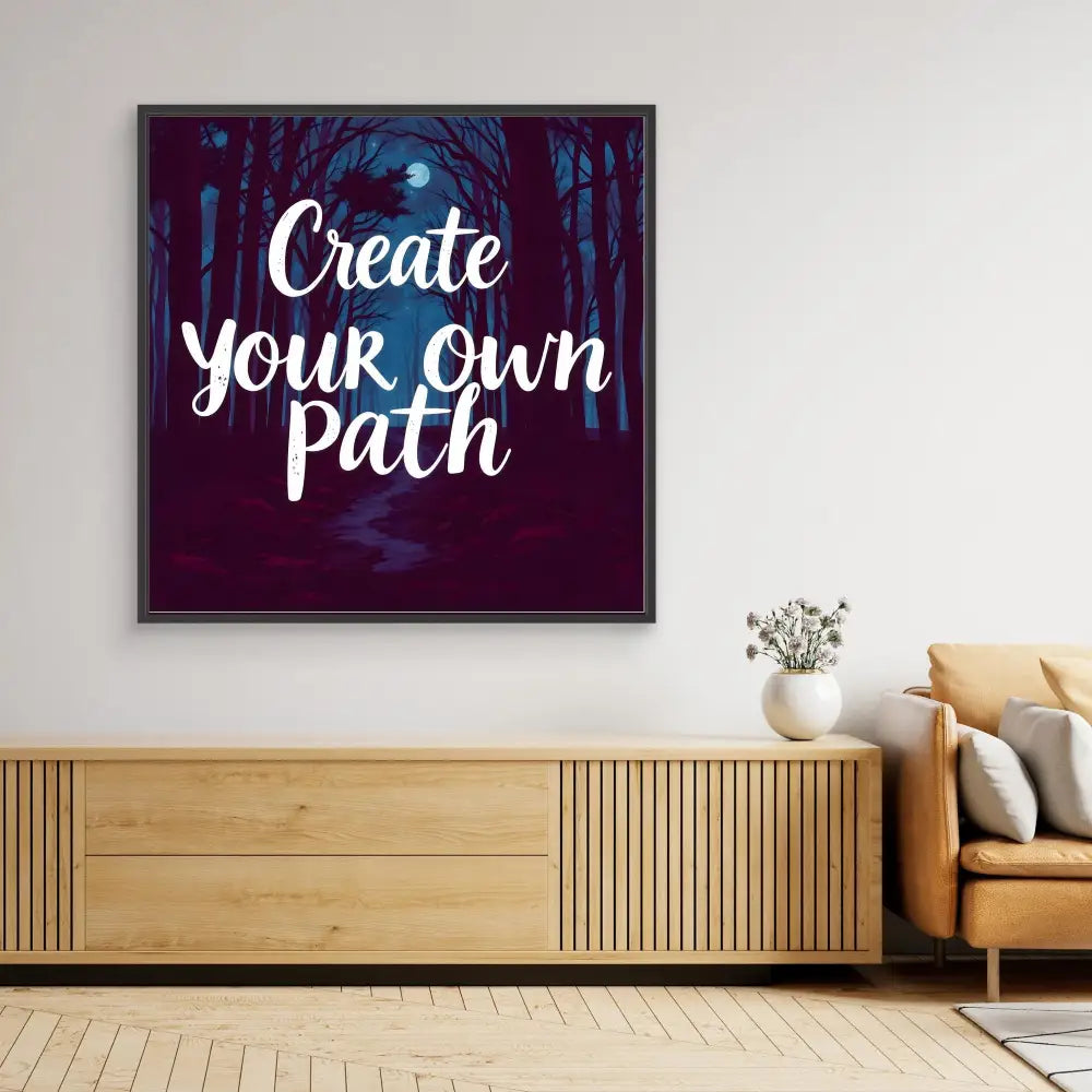 Motivational wall art featuring white text ’Create Your Own Path’ on a dark forest background.