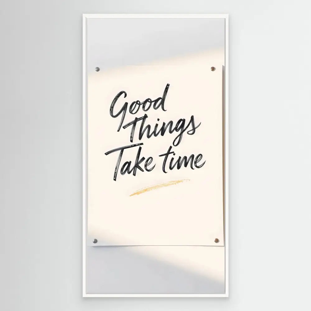 A motivational wall sign with handwritten text reading ’Good Things Take Time’