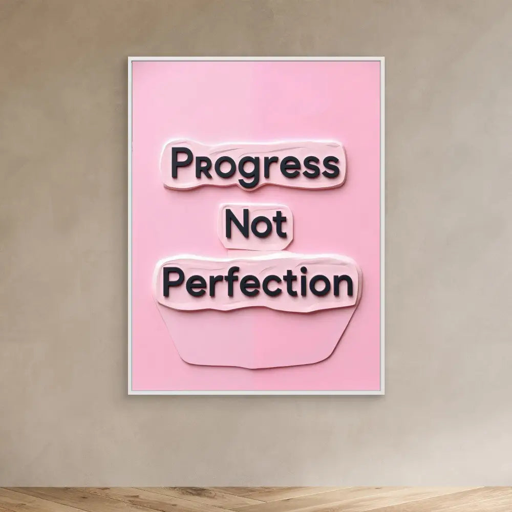 A pink motivational poster displaying ’Progress Not Perfection’ in black text.