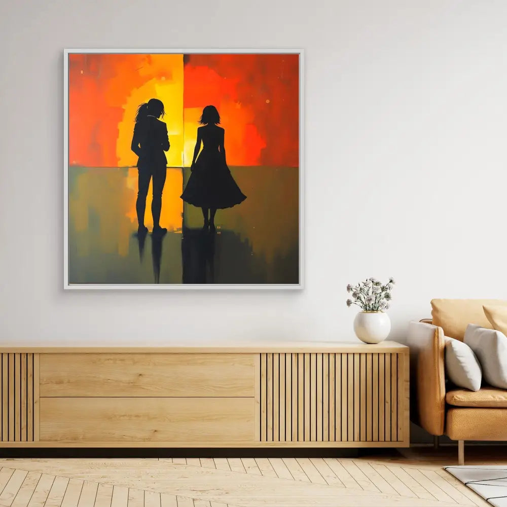 Silhouetted artwork of two figures against a vibrant orange and red sunset backdrop.