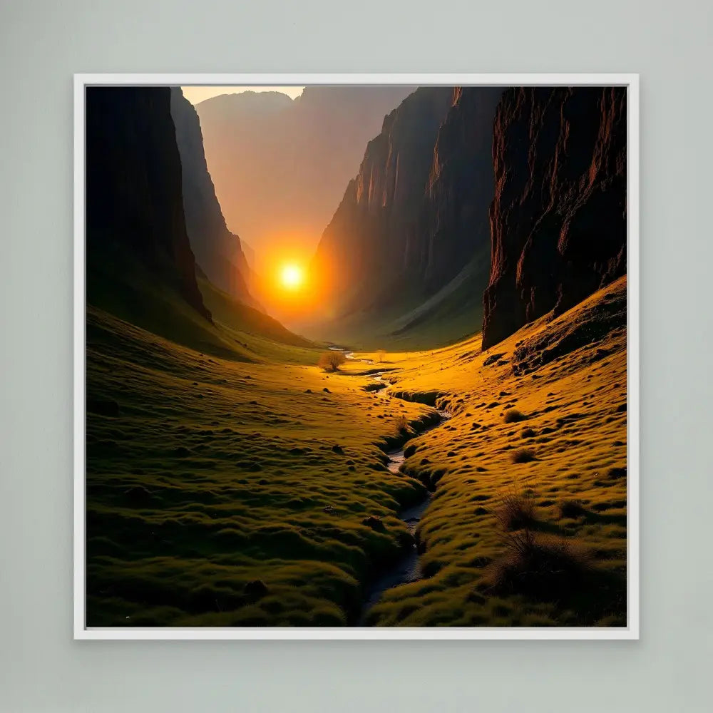 A winding stream flows through a sunlit mountain valley at sunset.