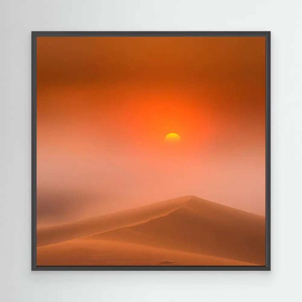 Sun setting behind desert dunes in an orange sky.